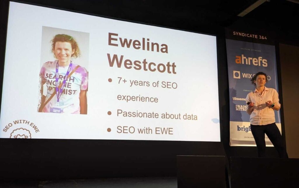 a person speaking on a stage during BrightonSEO